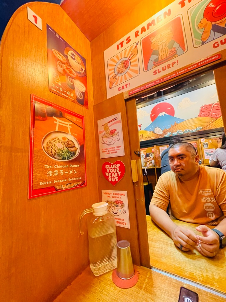 stainless cup with a pitcher of room-temperature water on the left.