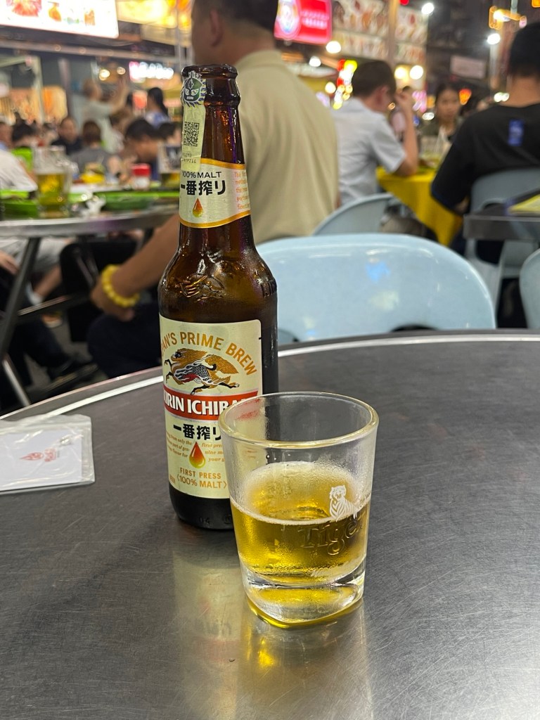 A Bottle of Beer with glass half full​