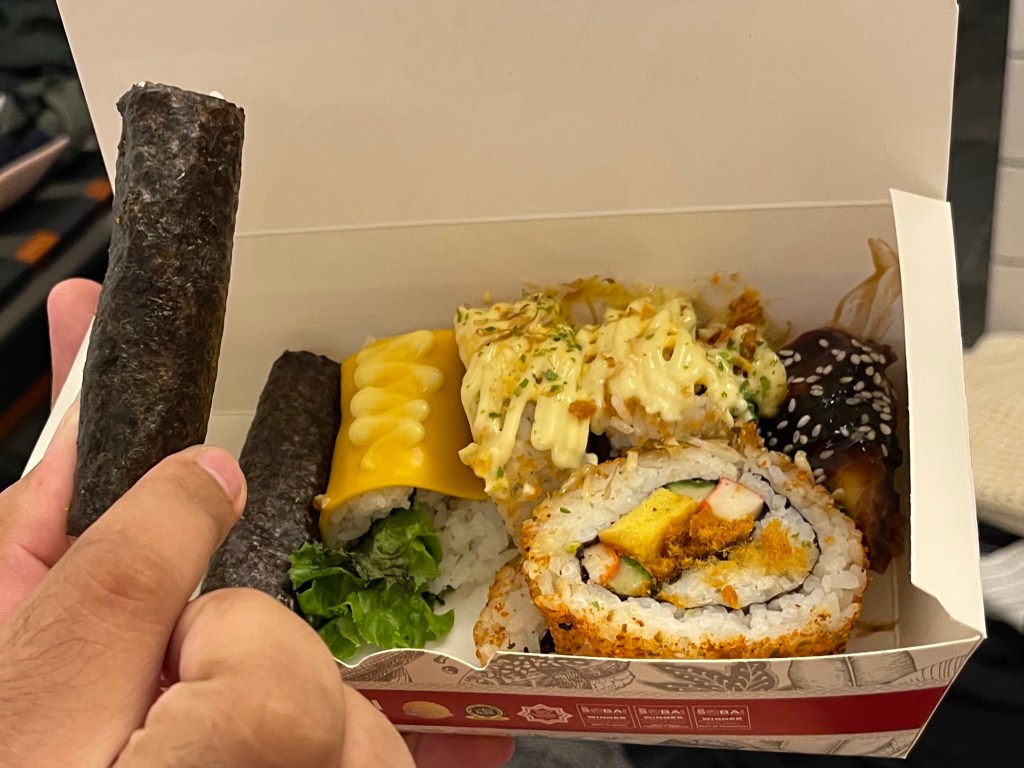 Box of Empire Sushi Order: Assortment of sushi and sushi rolls